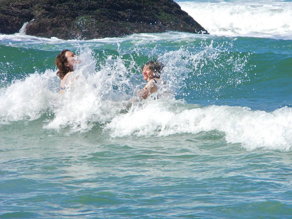 Karen and I swimming in the waves on South Port Beach.