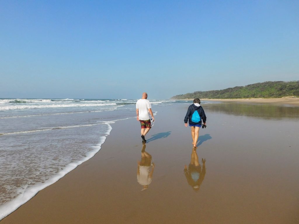 Cornรฉ and I walking on the beach at the Wild Coast.
